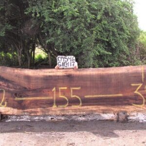 Large wooden slab with numbers painted on.