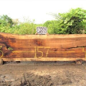 Large wooden slab with numbers and sign.