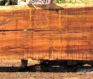 Large wooden slab with visible crack.