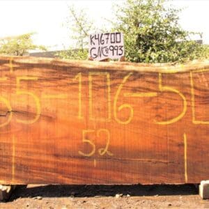 Large wooden slab with numbers painted on.