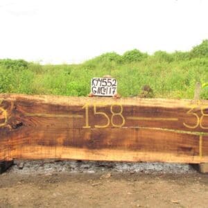 Large wooden slab with numbers and sign.