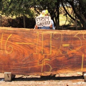 Large wooden slab with yellow markings displayed.